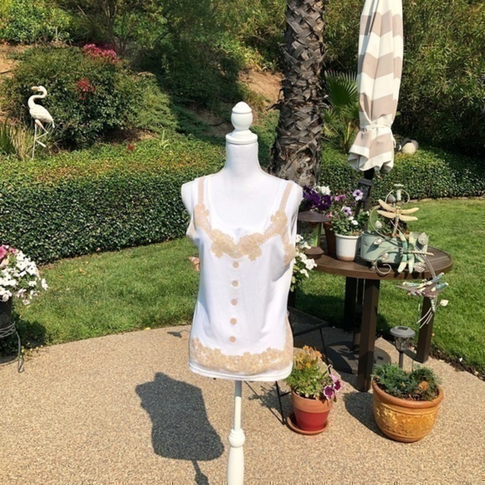 - Women’s white Size 5  white Tank.